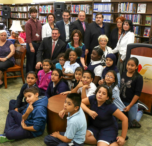 Back row, from left: Children's Librarian Ken Gordon; Maria Concolino, Friends of Woodhaven Library; NYC Council Member Eric Ulrich; Queens Library President and CEO Thomas W. Galante; Assembly Member Michael Miller; Evelyn Cruz on behalf of Rep. Nydia Velasquez; Maria Thomson, Greater Woodhaven Development. Front row, from left: NY Sen. Joseph P. Addabbo; NYC City Council Member Elizabeth Crowley; Borough President Helen Marshall