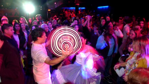 The public dances during this music festival.