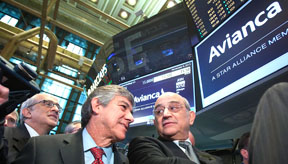 The CEO of Avianca  Fabio Villegas Ramirez ( L) celebrates their IPO at the New York Stock Exchange in New York, November 6, 2013.    Carlo Allegri/NYSE EURONEXT