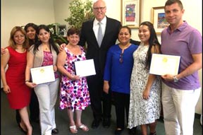Rep. Crowley honors members of Ecuadorian International Center and immigration services provider, Solution Docs for their help in assisting 9/11 clean-up worker Martha Freire (third from right).