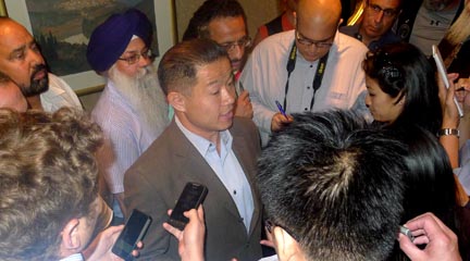 John Liu campaigning in Flushing last month.