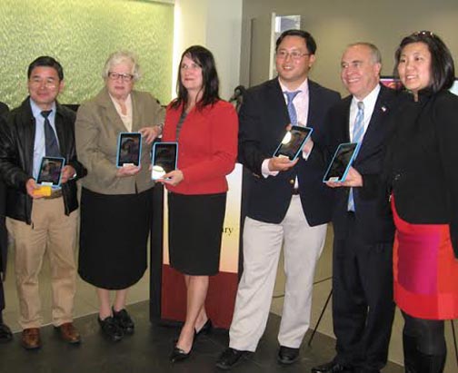 Google Tablets at Flushing. (l. to r.) NY City Council Member Peter Koo; NY State Sen. Toby Ann Stavisky; Queens Library's Interim President and CEO Bridget Quinn-Carey; NY State Assembly Member Ron Kim; NY State Comptroller Thomas DiNapoli; Congresswoman Grace Meng