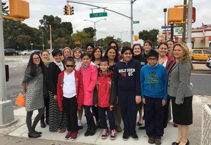 Queens Borough Commissioner Nicole Garcia, Assistant Commissioner for Education and Outreach Kim Wiley-Schwartz and Principal and students of PS 11 in Woodside, Queens celebrate International Walk to School Day along Queens Boulevard in the World’s Borough.