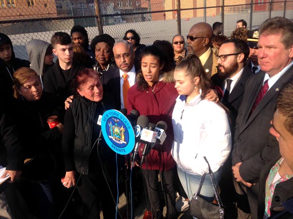 Senator Jose Peralta, at center with members of Ovidio Jaramillo's familiy on Northern Boulevard, Queens.