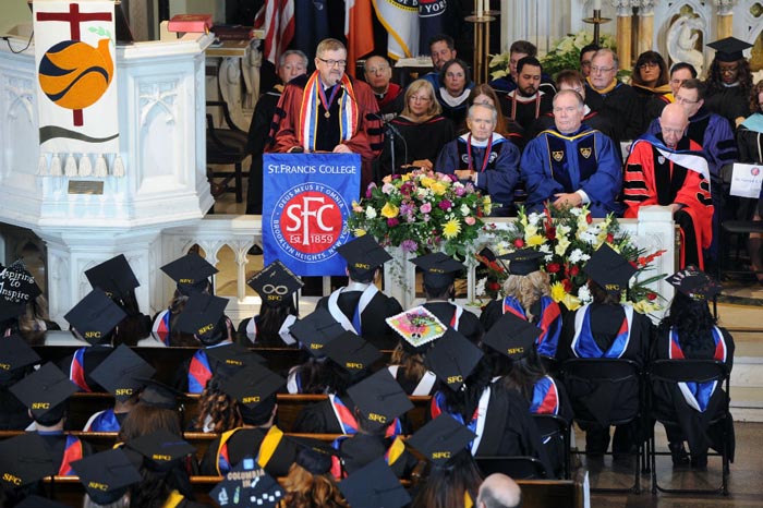 Gerald Galgan in front of the microphone at St. Francis College.
