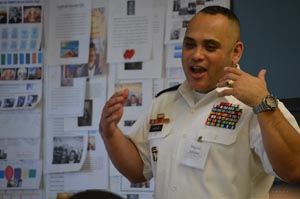 Passionate about his 30-year Army career, Army Chief Warrant Officer 5 Manuel "Manny" Vasquez (center), returns to his alma mater at Aviation High School for Career Day 2016 to share his Army story with the curious students.  Hailing from Long Island City, Queens, Vasquez, is a 1987 Aviation High School graduate and has served in the U.S. Army for 30 years.  The school's administration invited Vasquez and a host of other graduates to participate in the 2016 Career Day, providing the students with a bigger picture of what various career fields are like today, the salary and benefits they command as well as the educational and technical training requirements required for today's workforce positions.