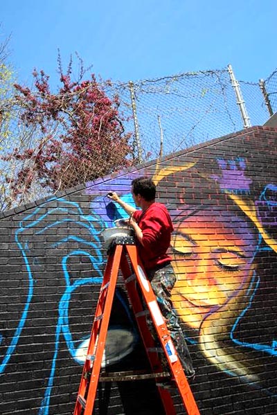 The artist hosted workshops with the students to develop concepts and designs for the mural.