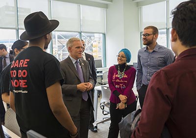 Councilman Jimmy Van Bramer talkin to students at LaGuardia Community College at the expanded library. 
