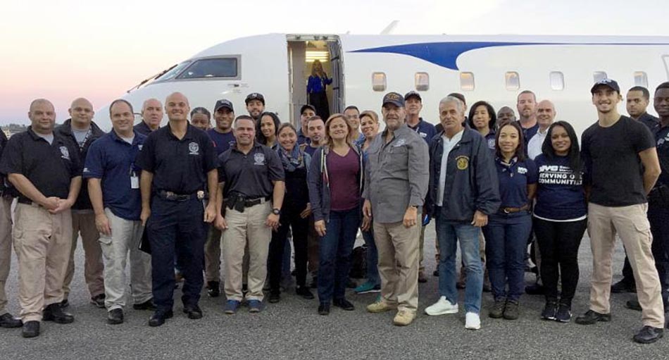 Councilwoman Melissa Mark-Viverito (center) and 22 NYC workers departed to Puerto Rico last weekend.